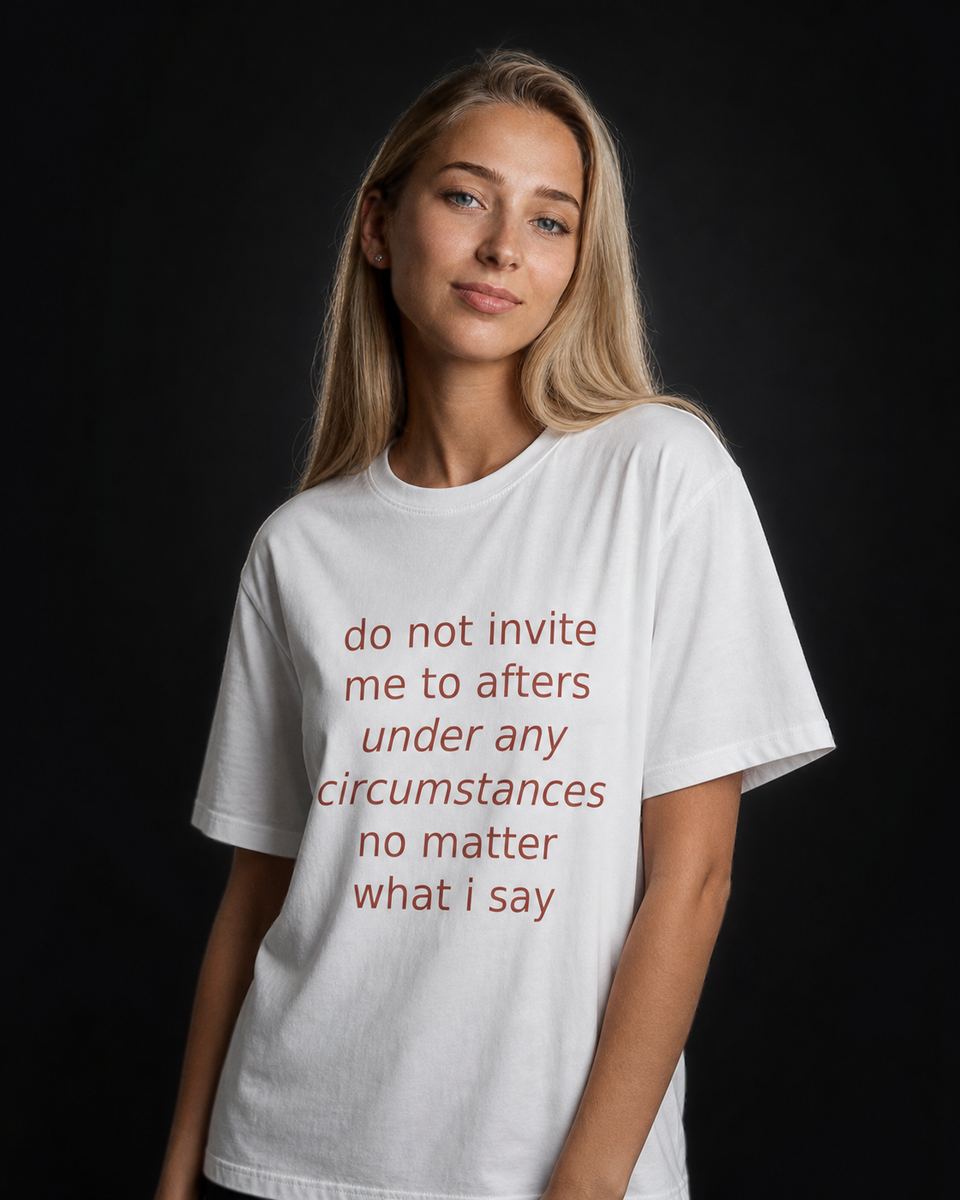 Model wearing the white Invite Me to Afters tee against a near-black background, coral italic print