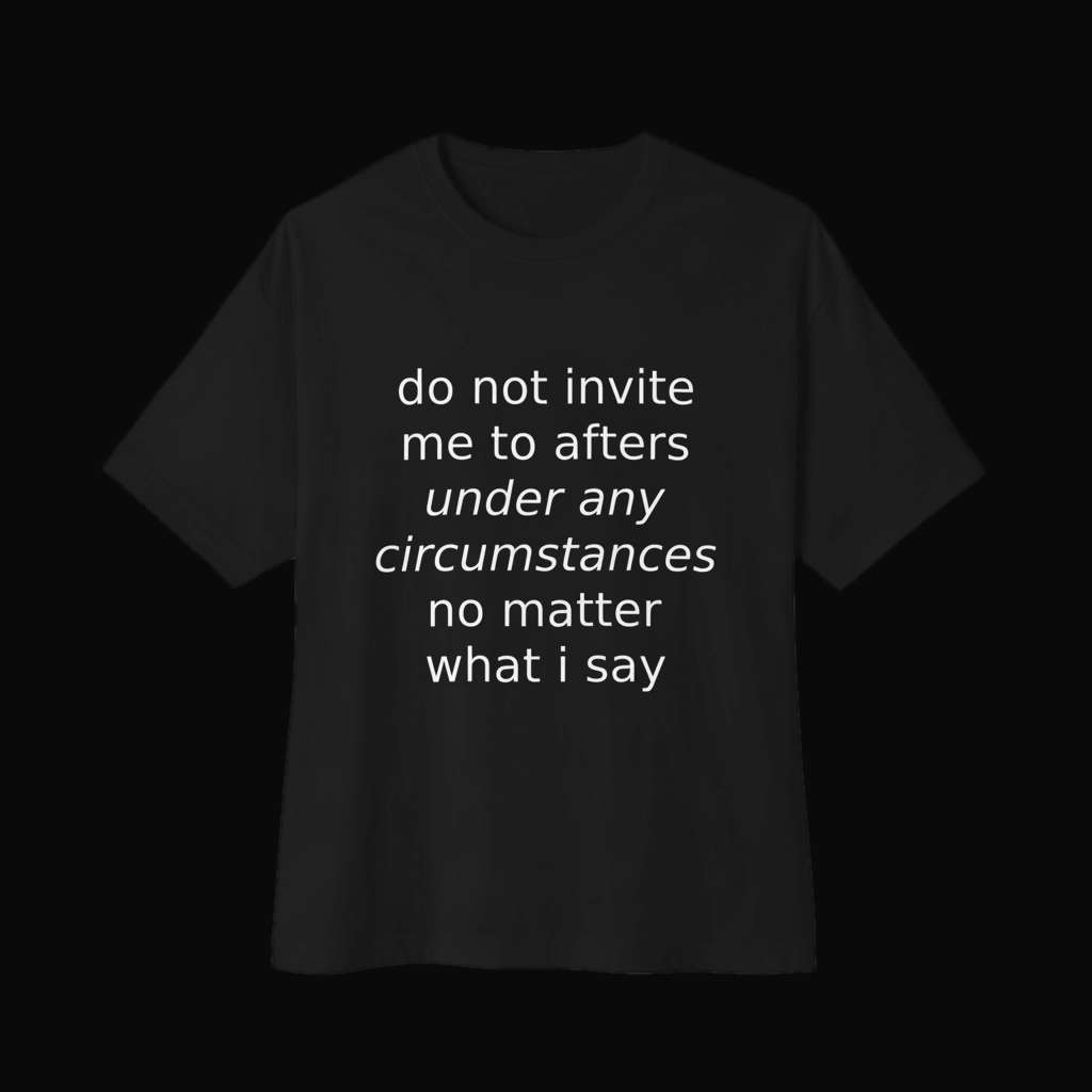 Black oversized boxy tee shown from an alternate angle on a near-black backdrop, white italic print
